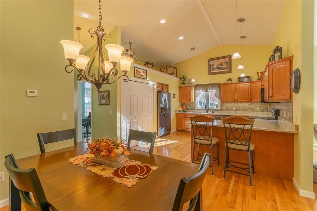15 Michael Drive, Unit 15 Thorndike, MA 01079 - Photo 12 of 27 a dining room with furniture and wooden floor