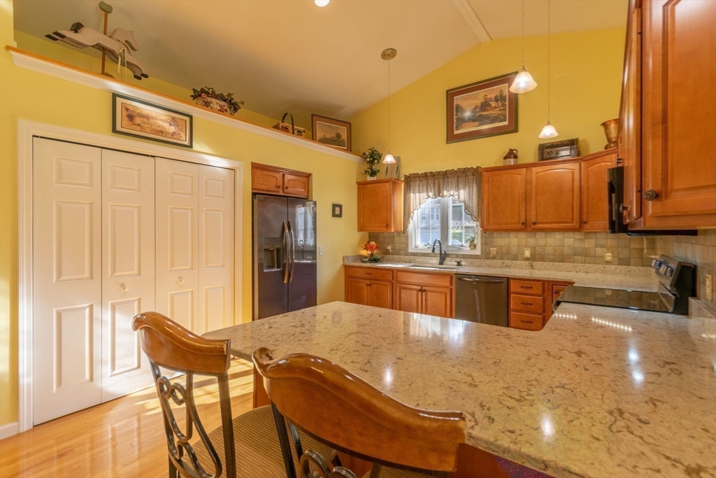 15 Michael Drive, Unit 15 Thorndike, MA 01079 - Photo 13 of 27 a kitchen with stainless steel appliances granite countertop a sink and cabinets