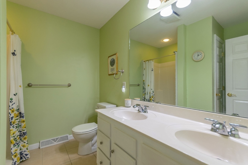 15 Michael Drive, Unit 15 Thorndike, MA 01079 - Photo 19 of 27 a bathroom with a sink and a mirror