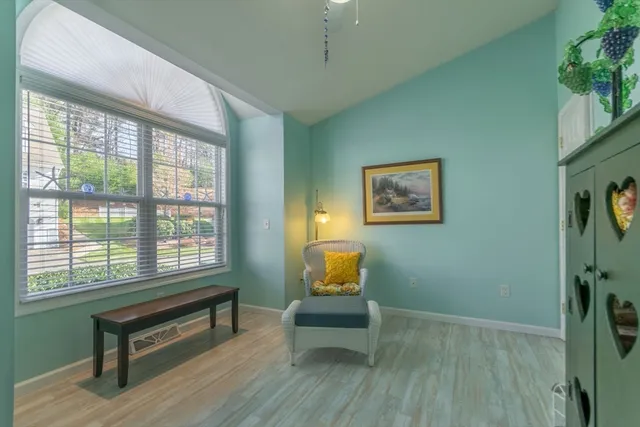 a living room with furniture and a window