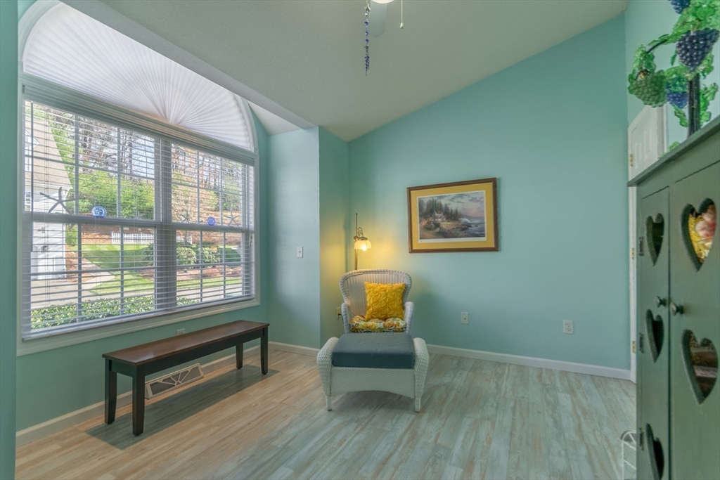 15 Michael Drive, Unit 15 Thorndike, MA 01079 - Photo 20 of 27 a living room with furniture and a window