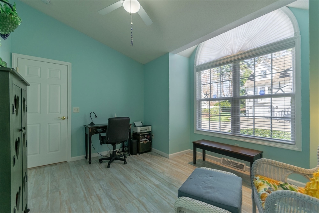 15 Michael Drive, Unit 15 Thorndike, MA 01079 - Photo 21 of 27 a living room with furniture and a window