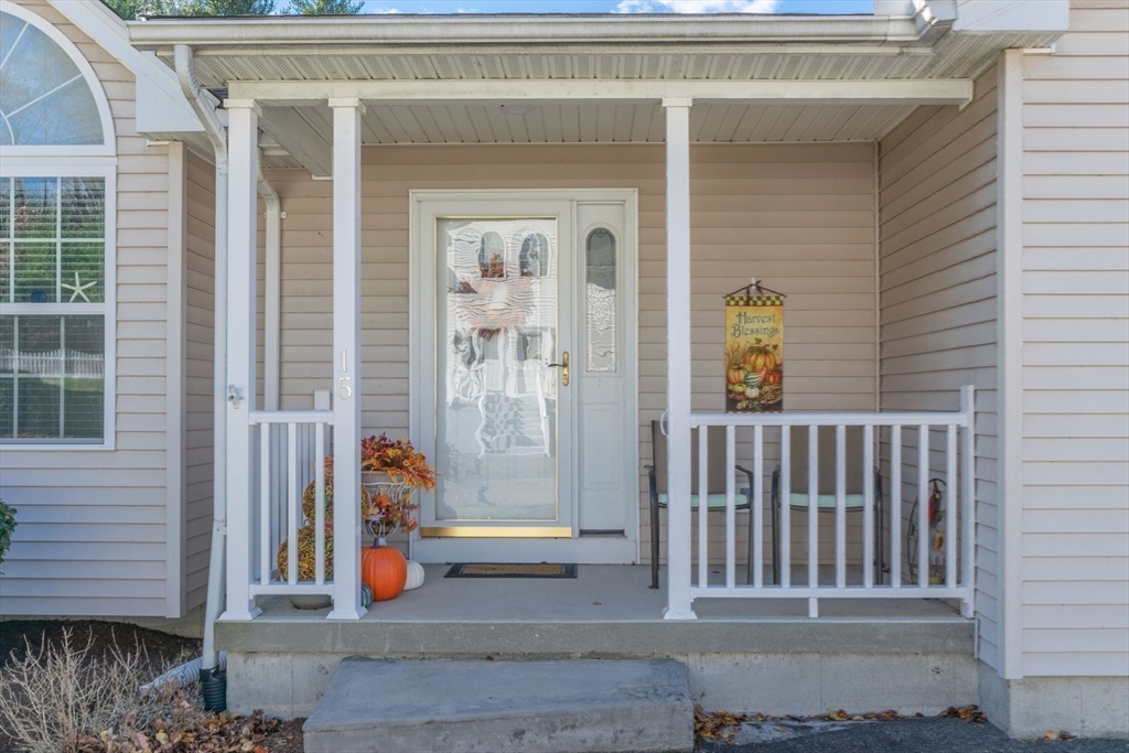15 Michael Drive, Unit 15 Thorndike, MA 01079 - Photo 22 of 27 a view of porch with a bench