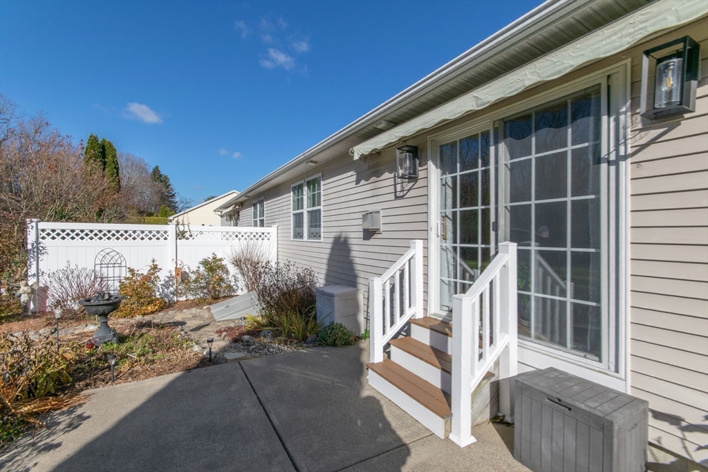 15 Michael Drive, Unit 15 Thorndike, MA 01079 - Photo 24 of 27 a house with a white fence