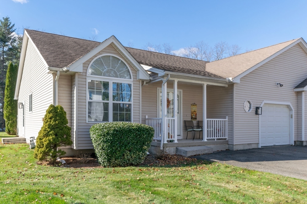 15 Michael Drive, Unit 15 Thorndike, MA 01079 - Photo 26 of 27 a front view of a house with garden