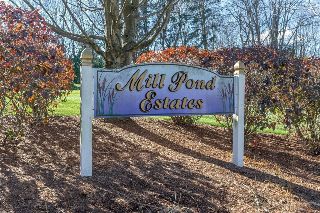 15 Michael Drive, Unit 15 Thorndike, MA 01079 - Photo 27 of 27 a sign on a sidewalk next to a road