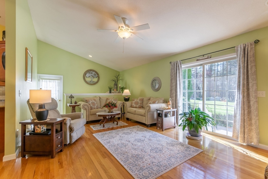 15 Michael Drive, Unit 15 Thorndike, MA 01079 - Photo 7 of 27 a living room with furniture and a large window