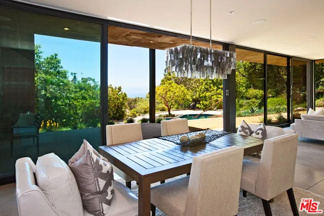 a view of an outdoor dining space with furniture