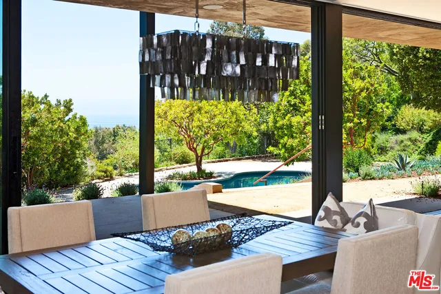 a view of sitting area with furniture and wooden floor