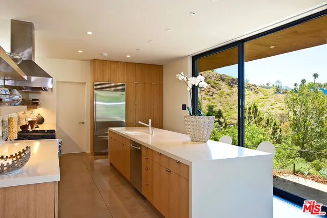 a bathroom with a double vanity sink and mirror