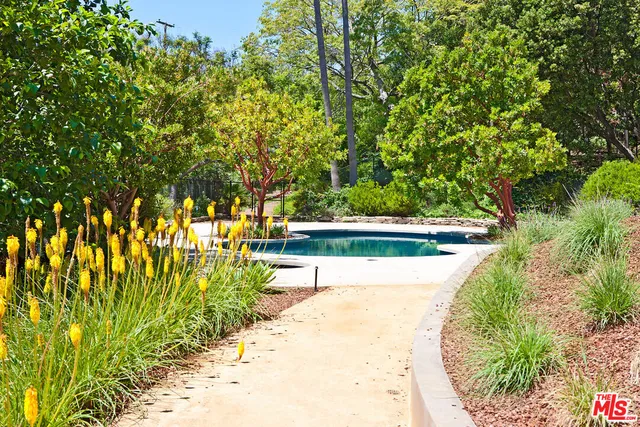a view of a swimming pool with a patio