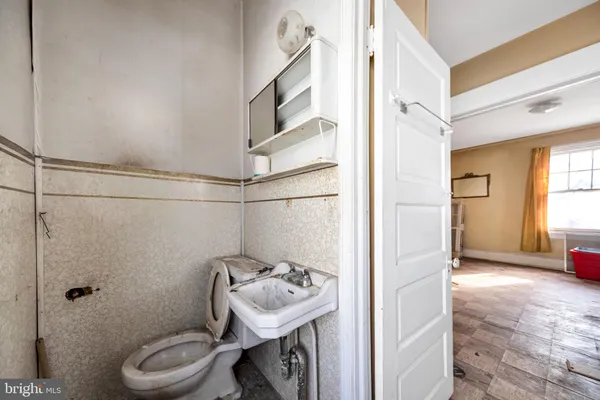 a living room with a couch and window