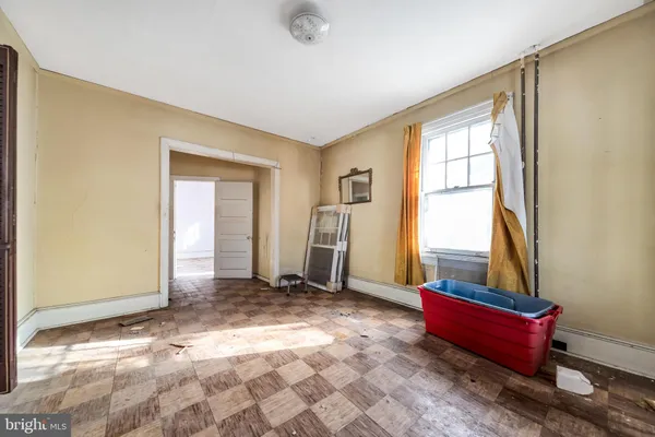 a view of an empty room and window