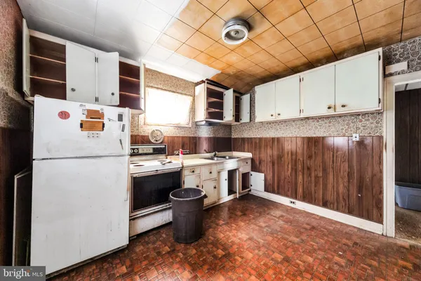 a bathroom with a granite countertop bathtub and sink