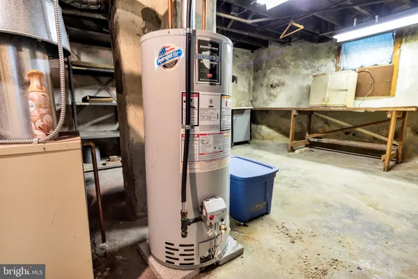 a view of walk in closet with clothes