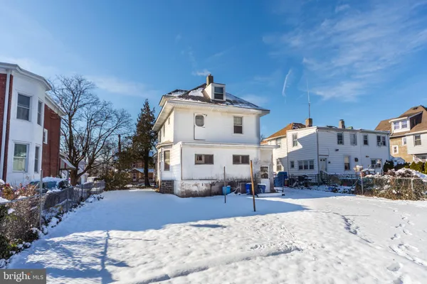 a view of a street with a house