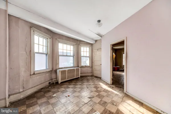 a view of an empty room and window