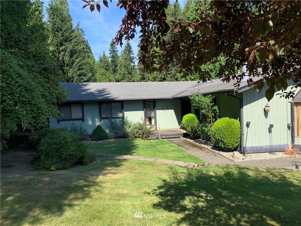 5615 227th Street Southeast Bothell, WA 98021 - Photo 1 of 30 a view of a house with a garden