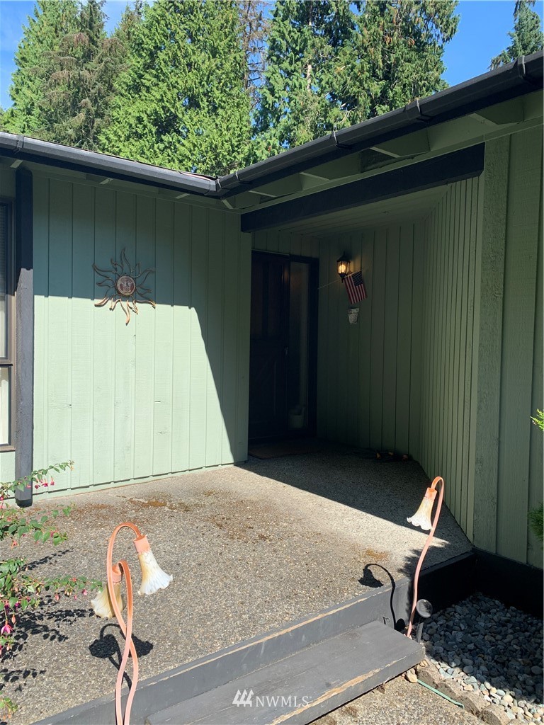 5615 227th Street Southeast Bothell, WA 98021 - Photo 13 of 30 a backyard of a house with table and chairs