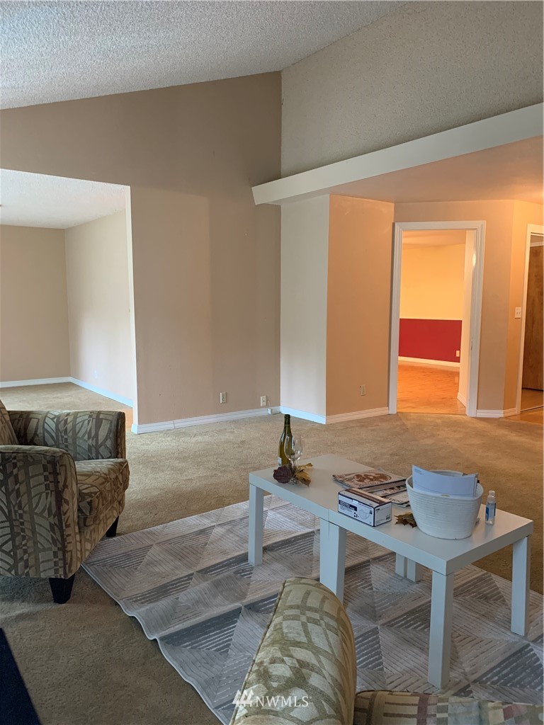 5615 227th Street Southeast Bothell, WA 98021 - Photo 18 of 30 a living room with furniture and a window