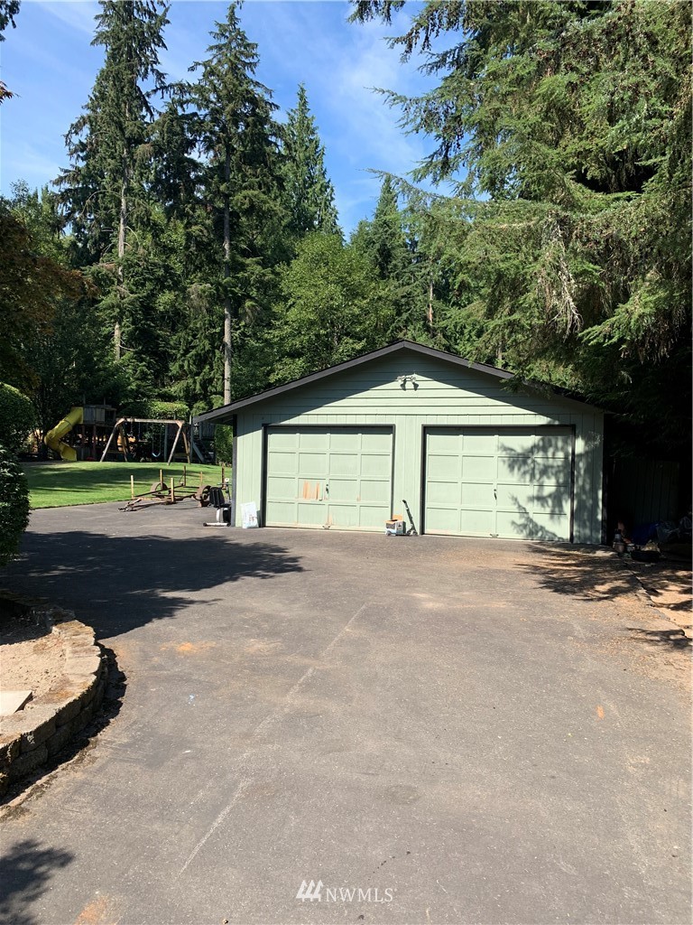 5615 227th Street Southeast Bothell, WA 98021 - Photo 8 of 30 a view of a house with a yard and garage