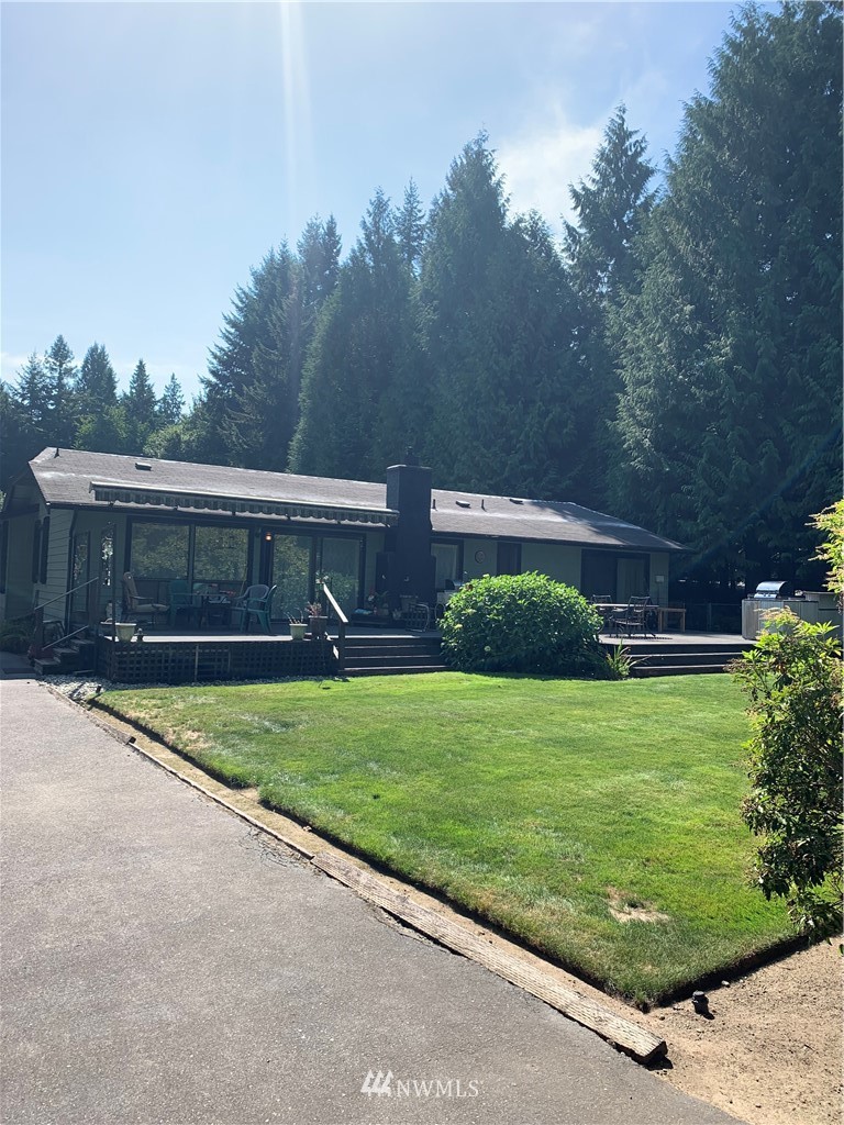 5615 227th Street Southeast Bothell, WA 98021 - Photo 9 of 30 a front view of a house with a yard and garage