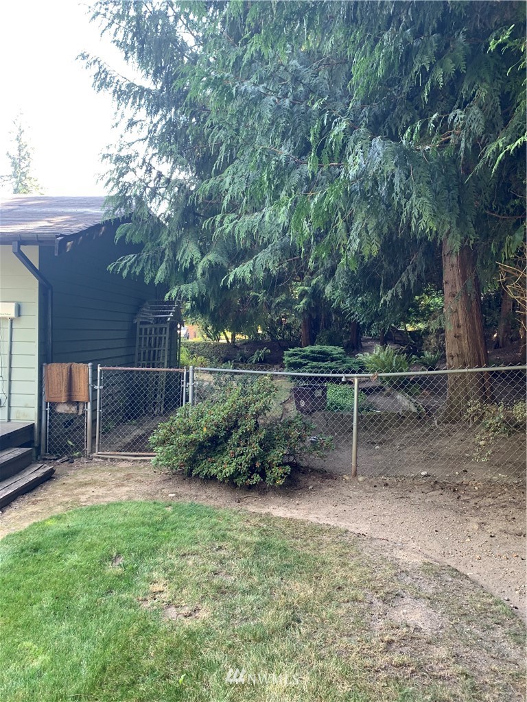 5615 227th Street Southeast Bothell, WA 98021 - Photo 10 of 30 a backyard of a house with lots of green space
