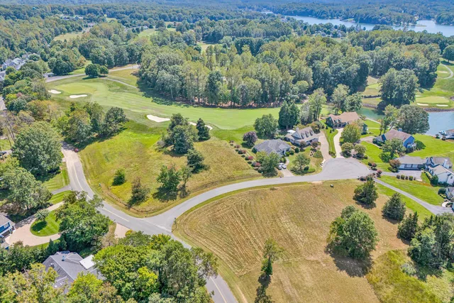 a view of a lake and a yard