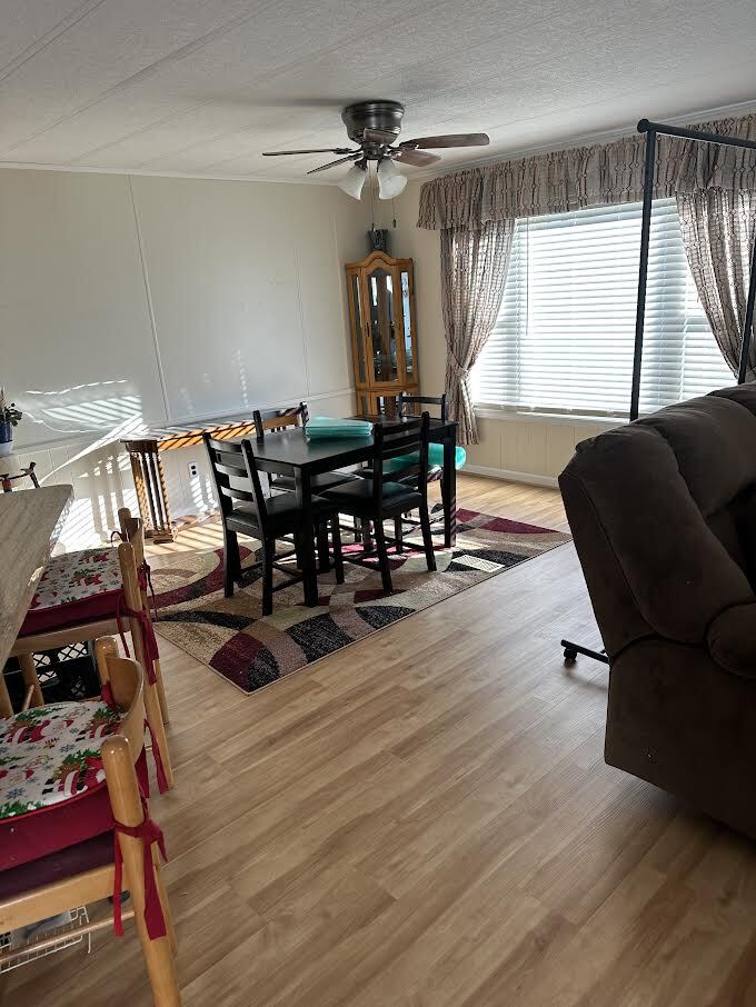 6801 South La Grange Road, Unit 155 Hodgkins, IL 60525 - Photo 3 of 8 a view of a dining room with furniture and window