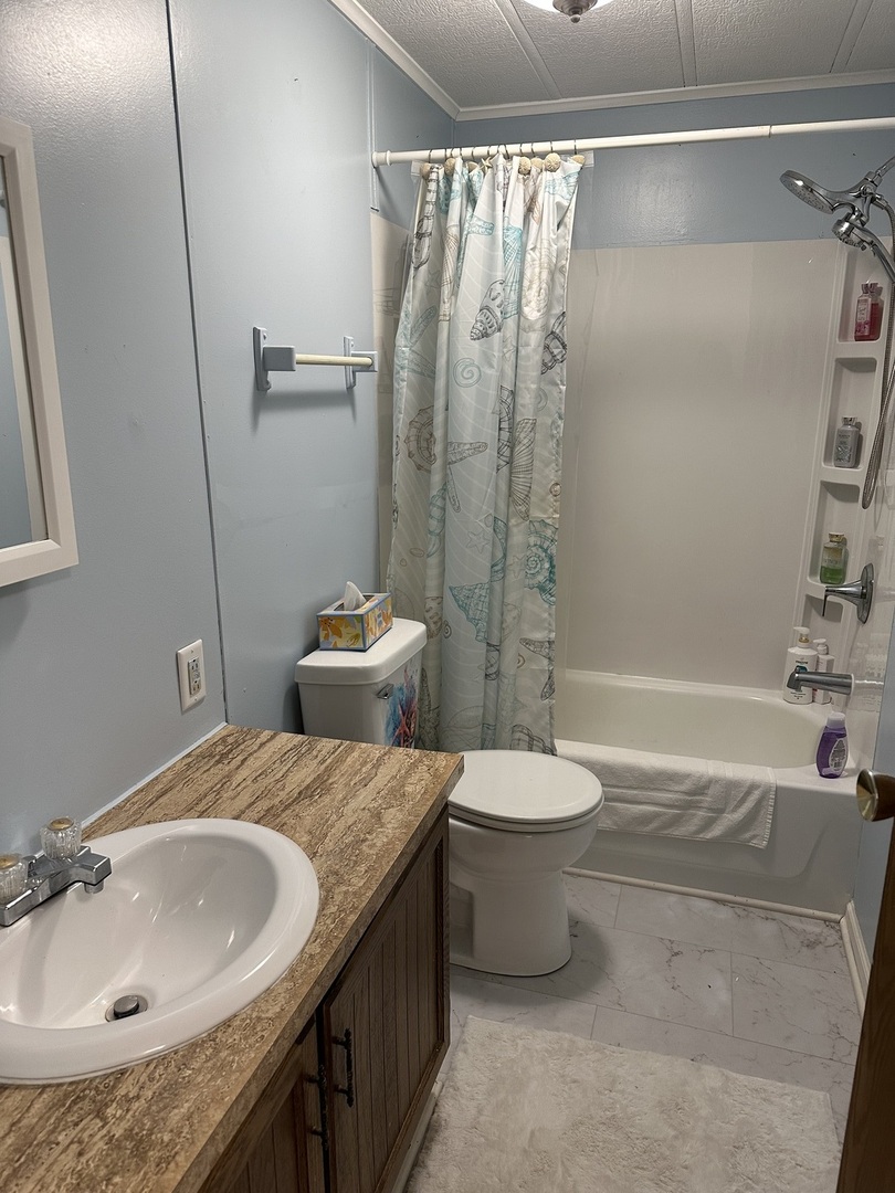 6801 South La Grange Road, Unit 155 Hodgkins, IL 60525 - Photo 8 of 8 a bathroom with a granite countertop sink toilet and shower