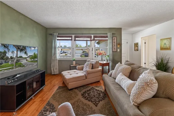 a front view of a house with a garden and yard