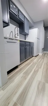 a view of a kitchen with a sink