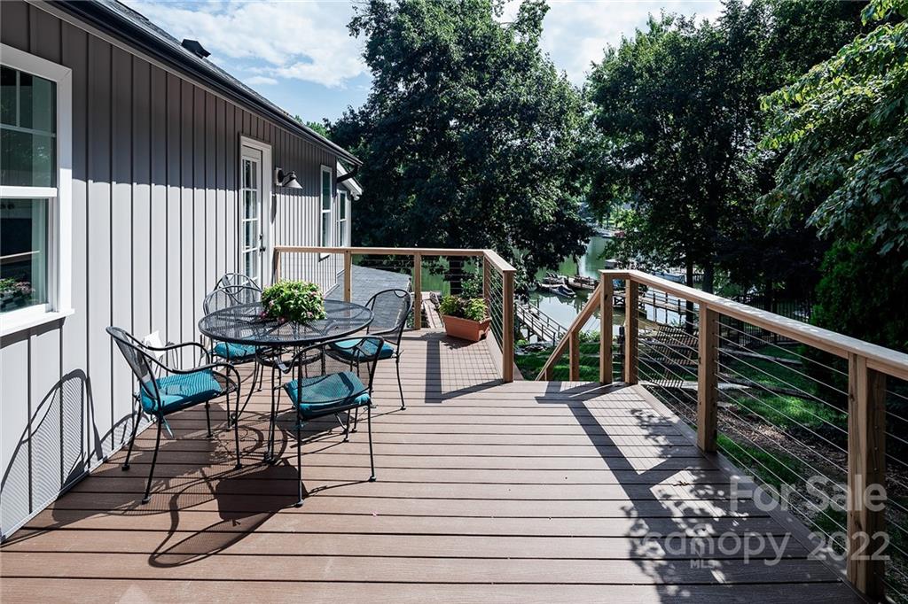 3654 Lake Shore Road South Denver, NC 28037 - Photo 37 of 48 a view of deck with furniture and trees