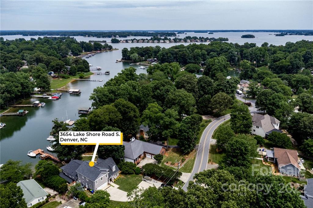 3654 Lake Shore Road South Denver, NC 28037 - Photo 45 of 48 an aerial view of a house with a garden and lake view