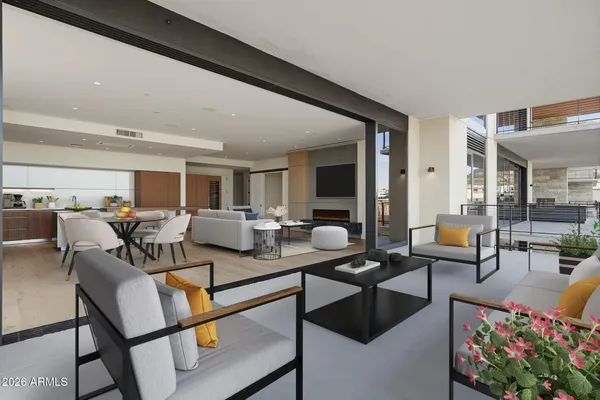 a kitchen with stainless steel appliances granite countertop a sink and a refrigerator