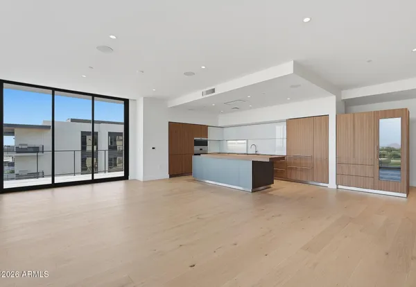 a view of a kitchen with a large window
