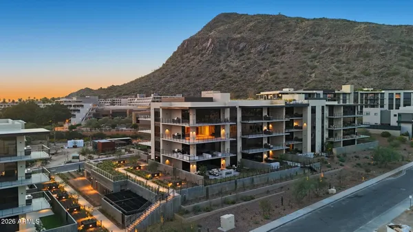 a room with water heater and a wooden bench
