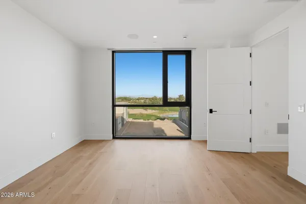 a view of a house with swimming pool and sitting area