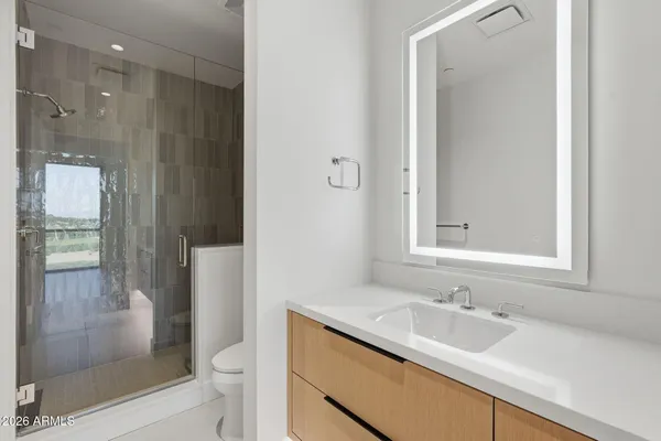 a view of a house with swimming pool and sitting area