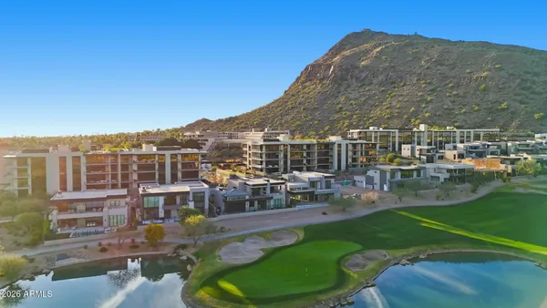 a view of a hallway with chairs