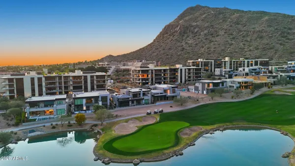 a view of a dining room with furniture large window and wooden floor
