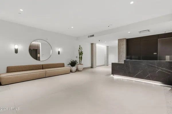 a view of an empty room with large windows