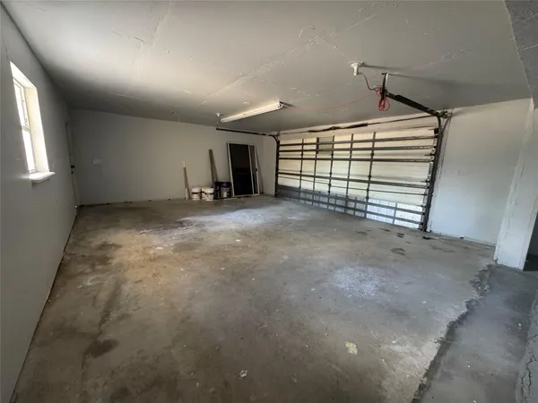 a view of an empty room with a windows