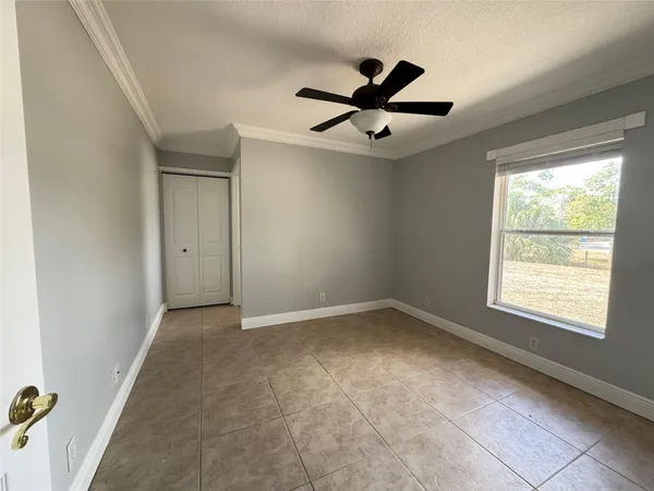 a view of an empty room with a window