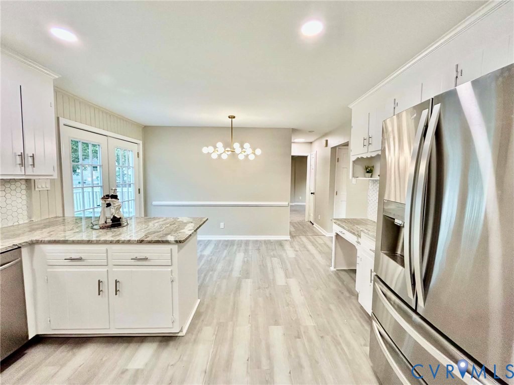 7110 Manning Road Chesterfield, VA 23832 - Photo 20 of 50 Chef's kitchen featuring white cabinetry with stai