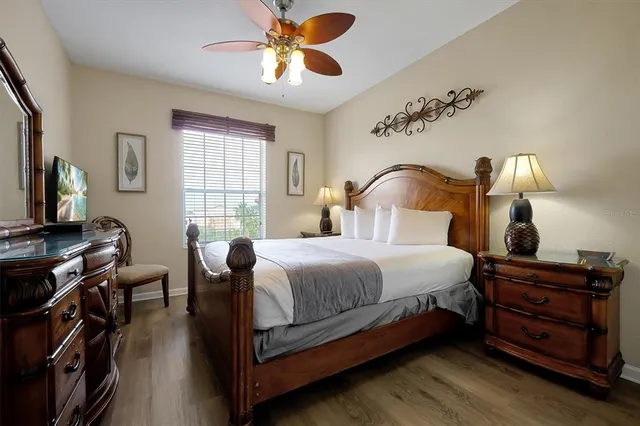 a bedroom with bed and window