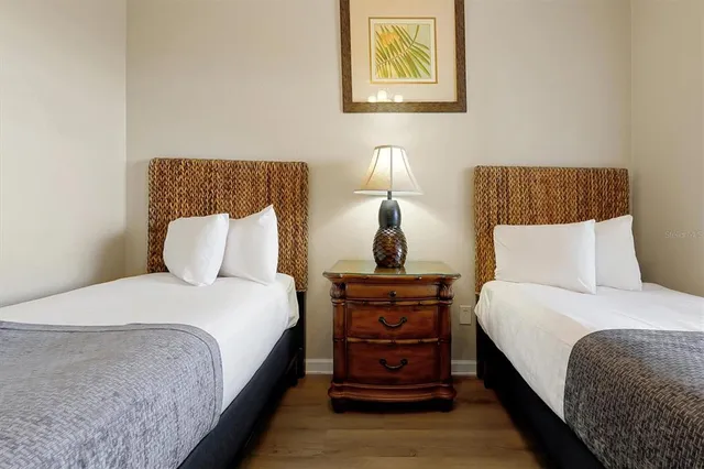 a bedroom with a bed and lamps