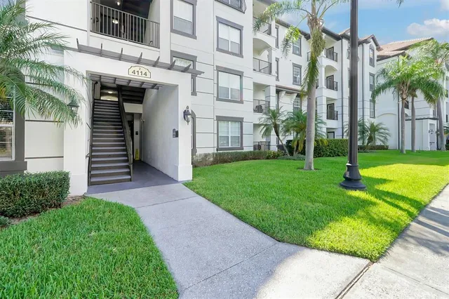 a view of a building with a yard