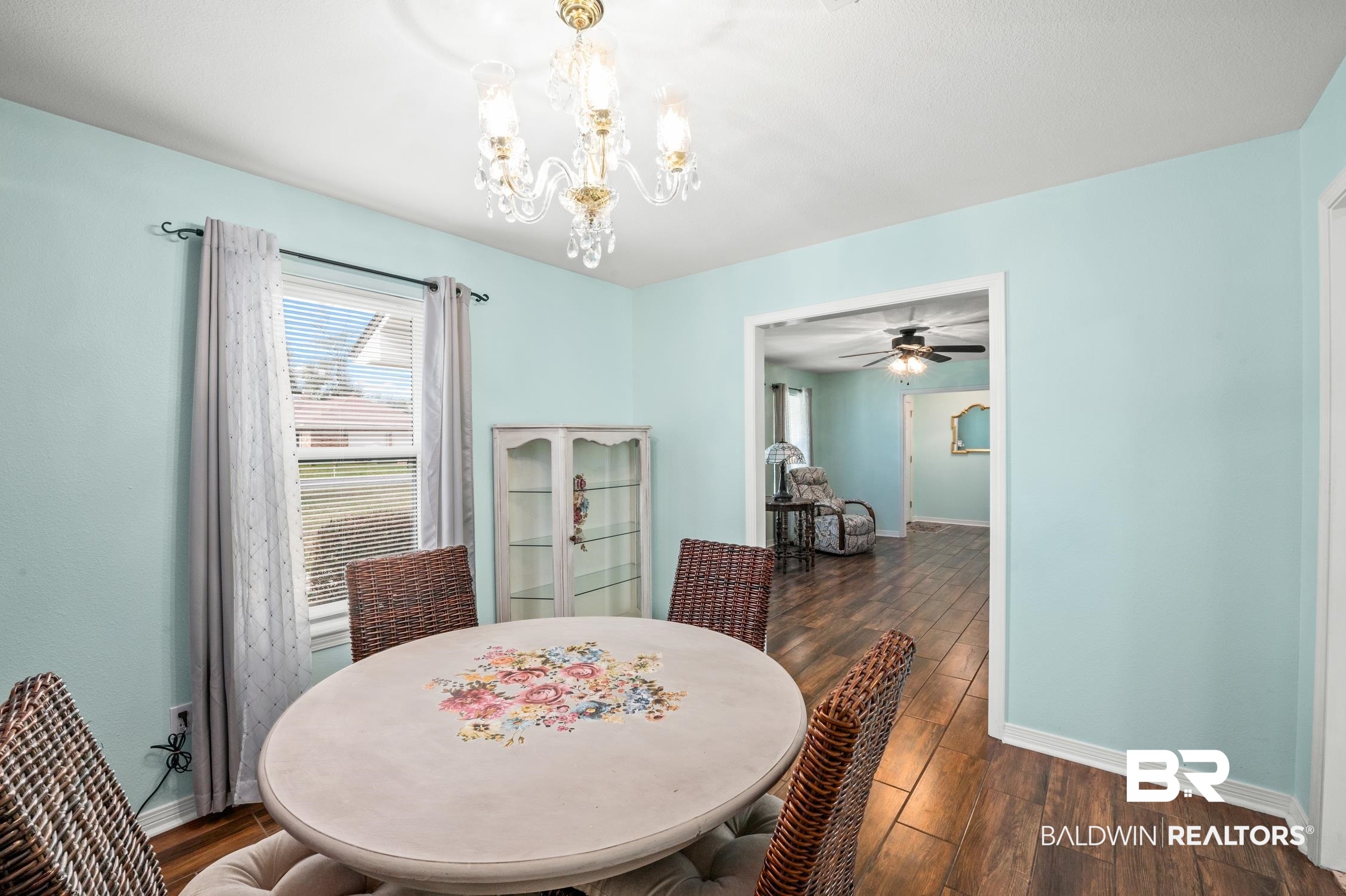 2553 Santa Rosa Drive Lillian, AL 36549 - Photo 13 of 51 Dining room with a chandelier, dark wood finished floors, and baseboards