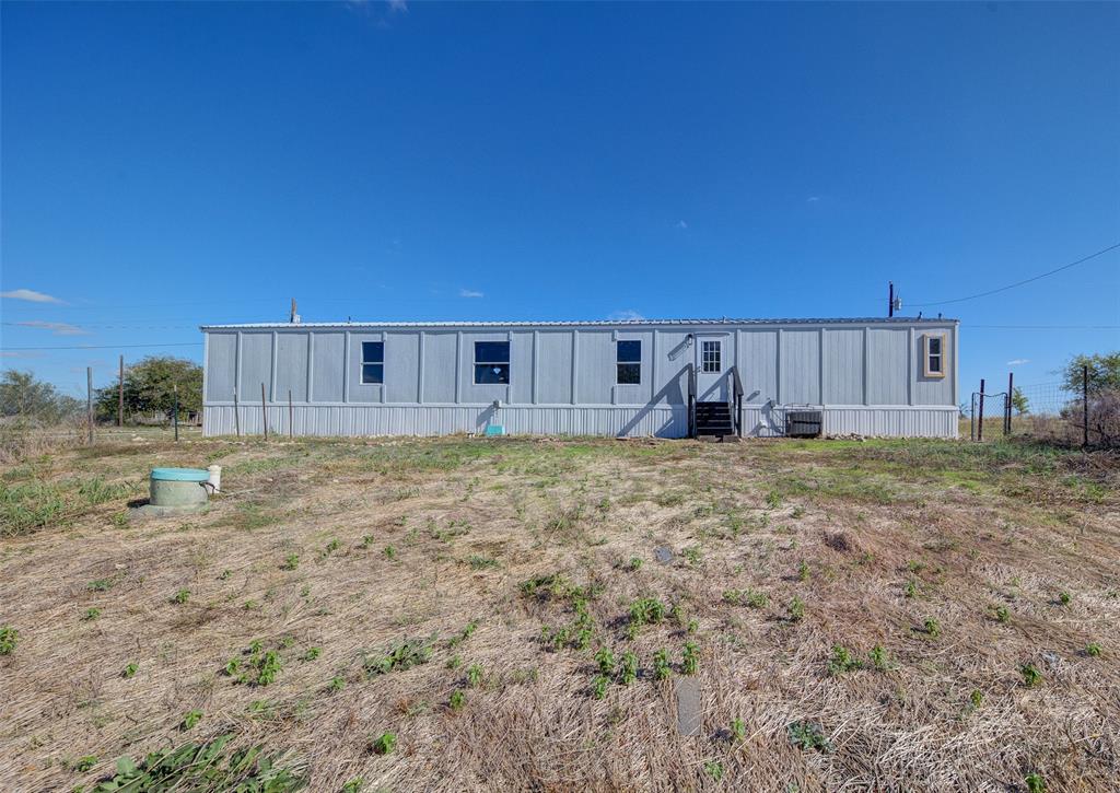 159 Happy Trl Court Rhome, TX 76078 - Photo 1 of 1 View of front of property with entry steps